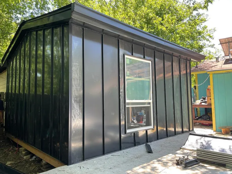 Black standing seam metal wall panels for Roof Inspection in Millbrae